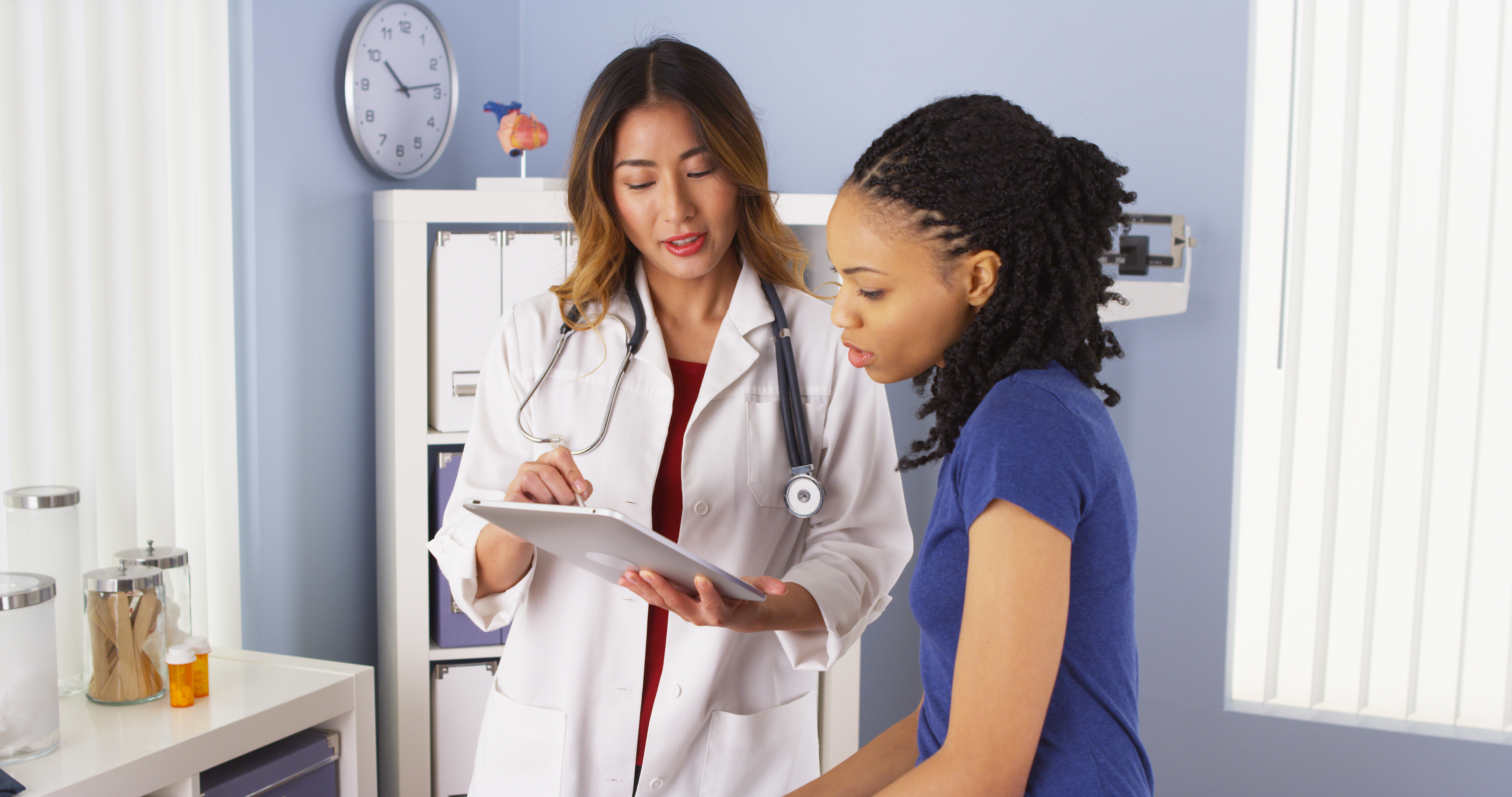 Doctor and Patient looking at an iPad